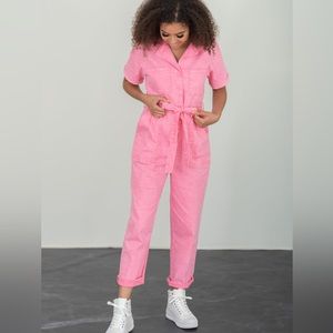 Washed pink, this straight-leg jumpsuit has cuffed short sleeves, and pockets